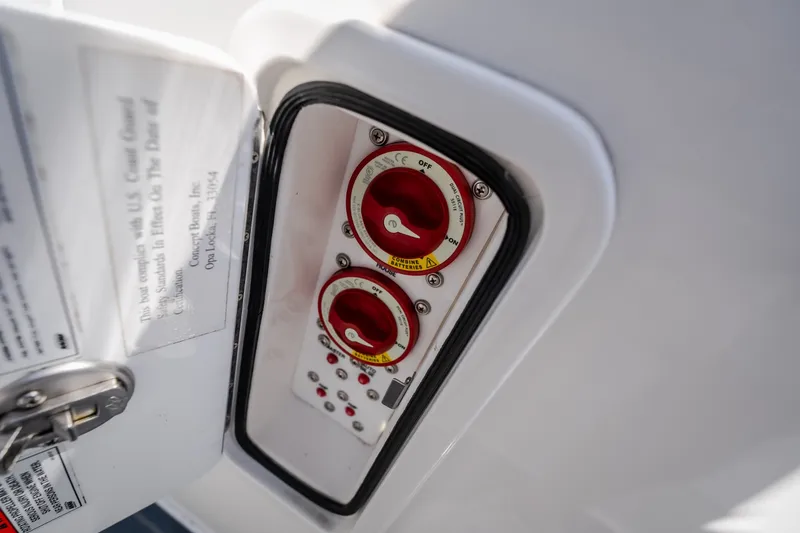 Slide: The Image of Control panel of a 2019 Concept 36' Cuddy Cabin boat with red switches. - 46