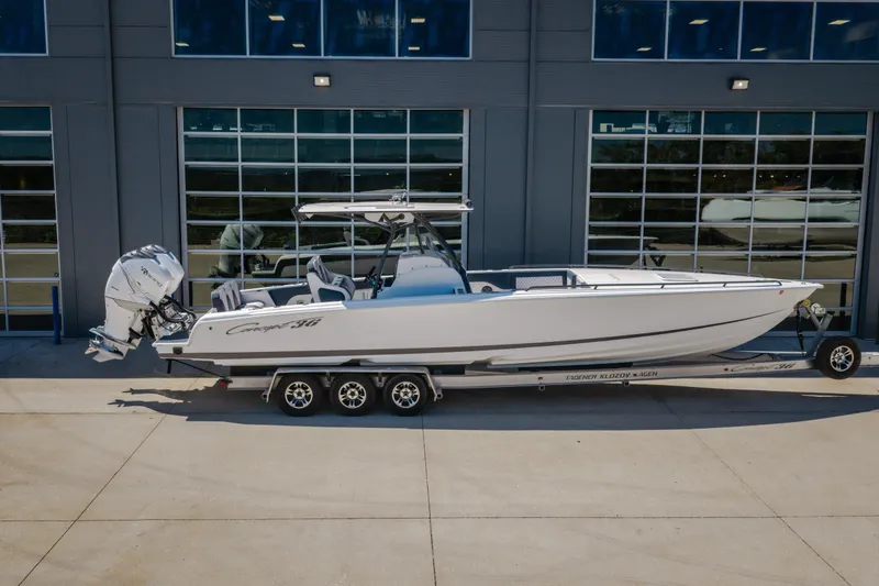 Slide: The Image of 2019 Concept 36' Cuddy Cabin boat on trailer, parked outside a building. - 49