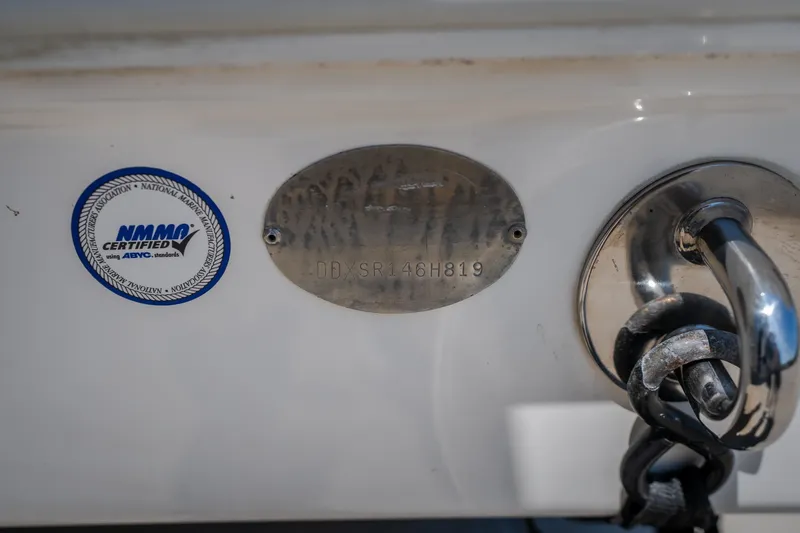 Slide: The Image of NMMO certified plaque on 2019 Concept 36' Cuddy Cabin boat with metal plate and chain. - 20