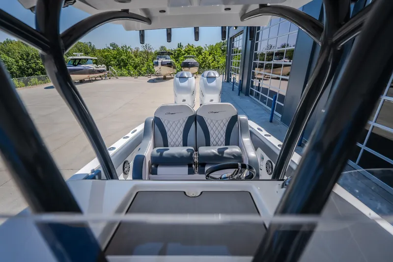 Slide: The Image of 2019 Concept 36' Cuddy Cabin boat interior with dual seats and steering wheel. - 37