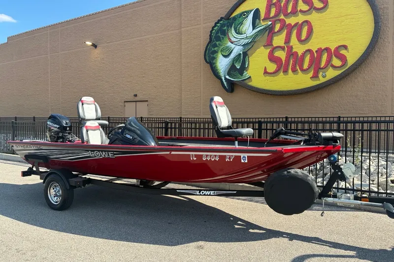 Slide: The Image of 2019 Lowe Stinger 175C boat in red, parked outside Bass Pro Shops. - 9