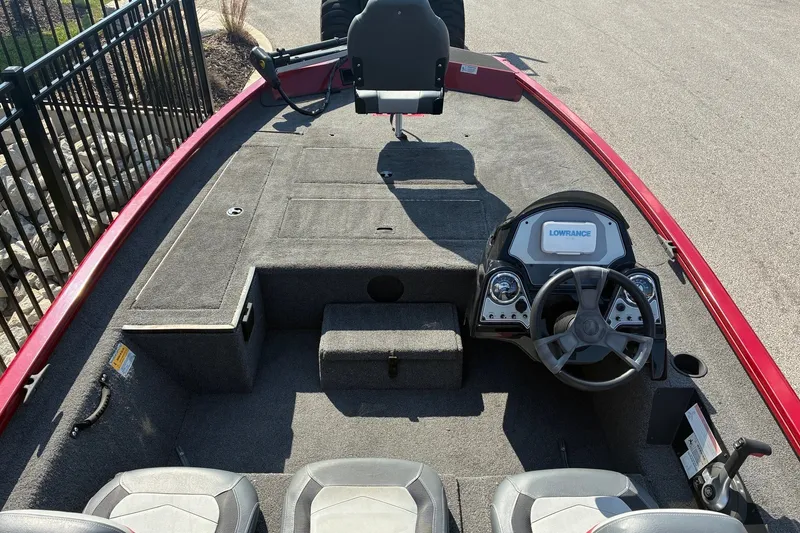 Slide: The Image of 2019 Lowe Stinger 175C boat interior with steering wheel and seating. - 13