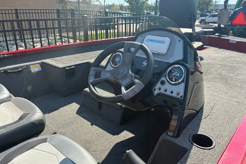 Slide: The Image of 2019 Lowe Stinger 175C boat interior with steering wheel and control panel. - 7