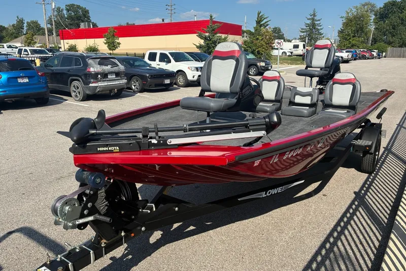 Slide: The Image of 2019 Lowe Stinger 175C boat in parking lot, featuring Minn Kota trolling motor. - 11