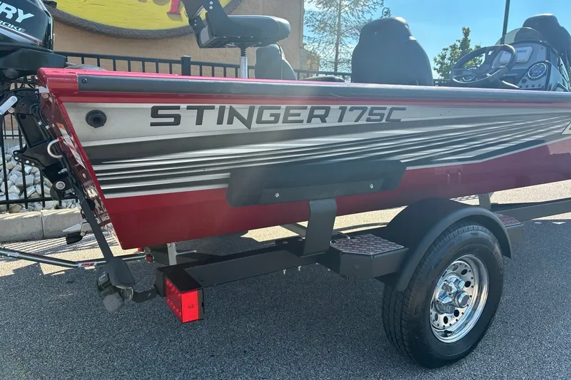 Slide: The Image of 2019 Lowe Stinger 175C boat on trailer, side view with visible branding. - 2