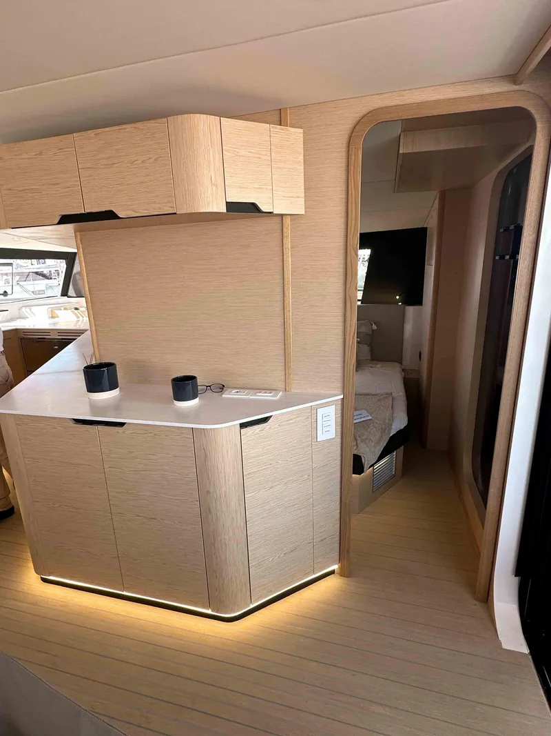 Slide: The Image of Modern interior of 2025 NEEL 52 yacht with sleek cabinetry and ambient lighting. - 13