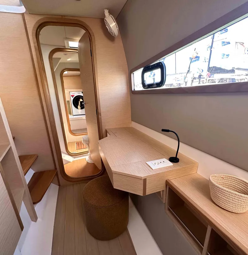 Slide: The Image of Modern interior of 2025 NEEL 52 trimaran with sleek design and natural wood finishes. - 16