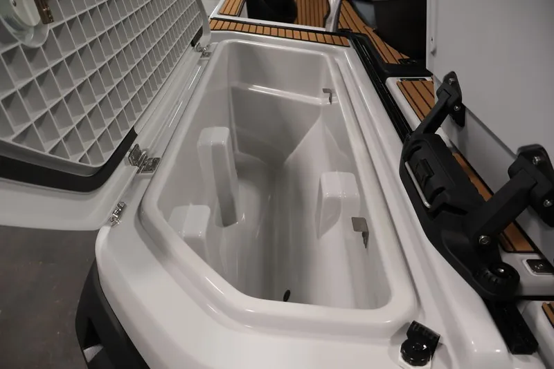 Slide: The Image of 2027 Yamaha WaveRunner Crosswave storage compartment, open lid, showcasing spacious interior design. - 9