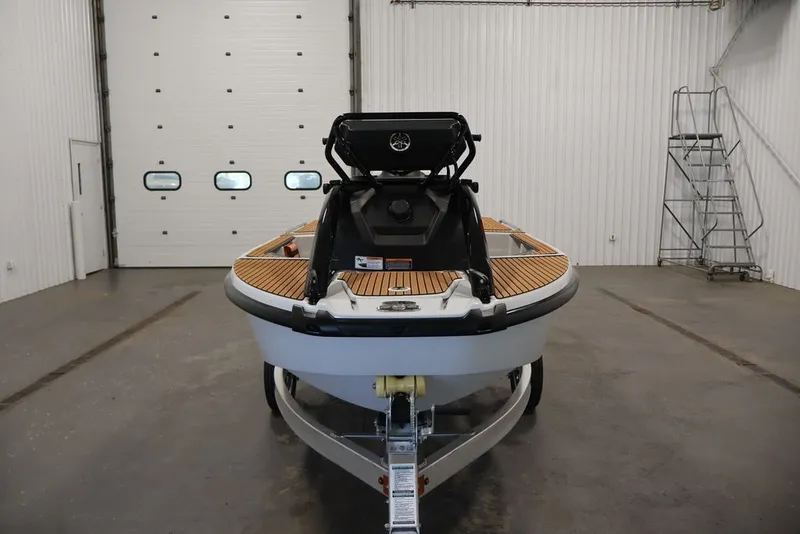 Slide: The Image of 2027 Yamaha WaveRunner Crosswave in a garage, showcasing sleek design and modern features. - 12