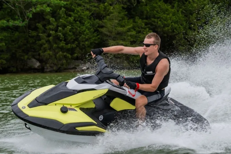 Slide: The Image of Man riding 2027 Yamaha WaveRunner JetBlaster on a lake, creating splashes. - 7