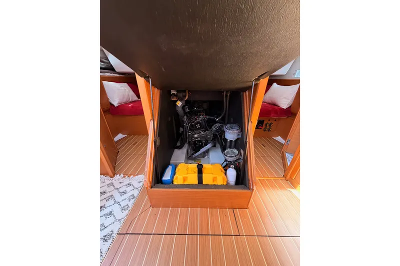 Slide: The Image of Engine compartment of 2014 Jeanneau Sun Odyssey 509 sailboat, showcasing interior mechanics. - 99