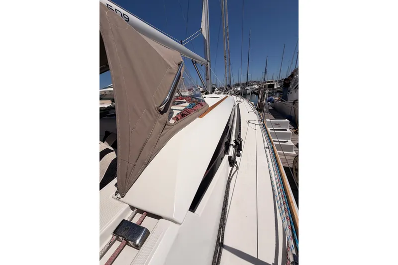Slide: The Image of 2014 Jeanneau Sun Odyssey 509 sailboat docked, showcasing deck and rigging details. - 30