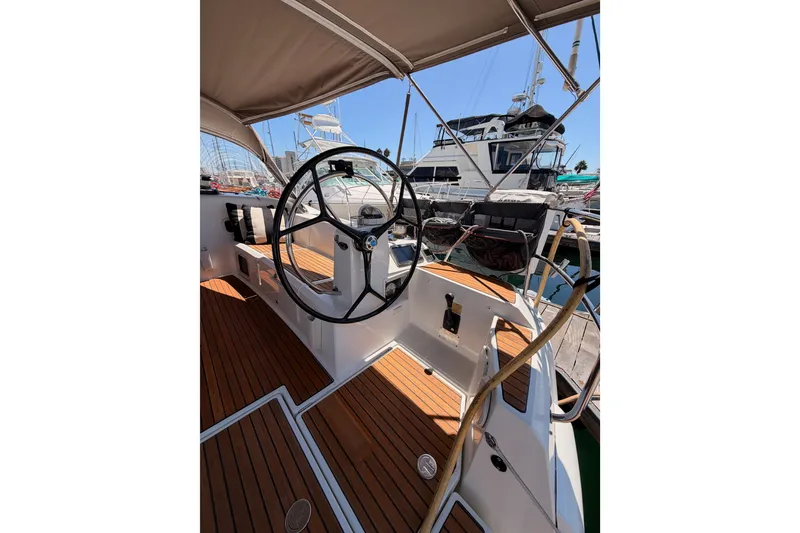 Slide: The Image of Cockpit of 2014 Jeanneau Sun Odyssey 509 sailboat with wooden deck and steering wheel. - 20