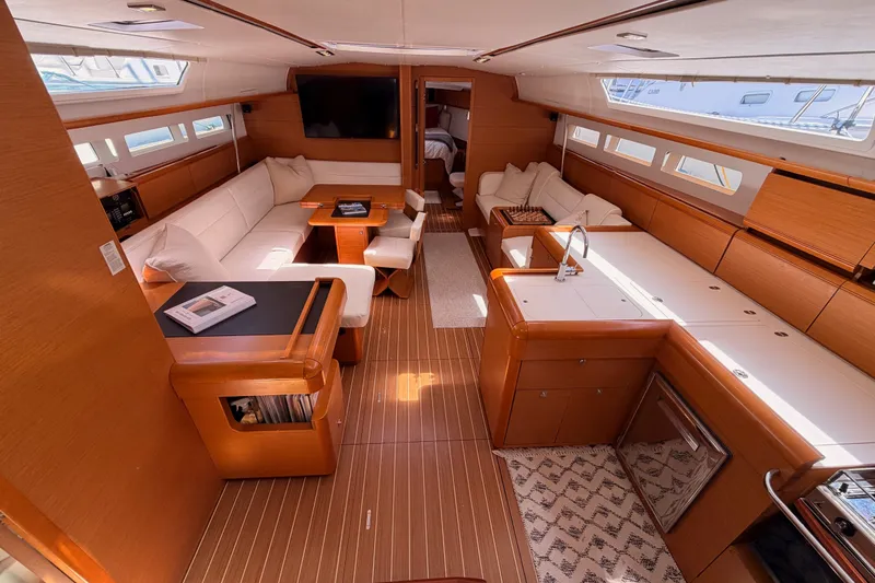 Slide: The Image of Luxurious interior of 2014 Jeanneau Sun Odyssey 509 yacht with modern furnishings and ample seating. - 51