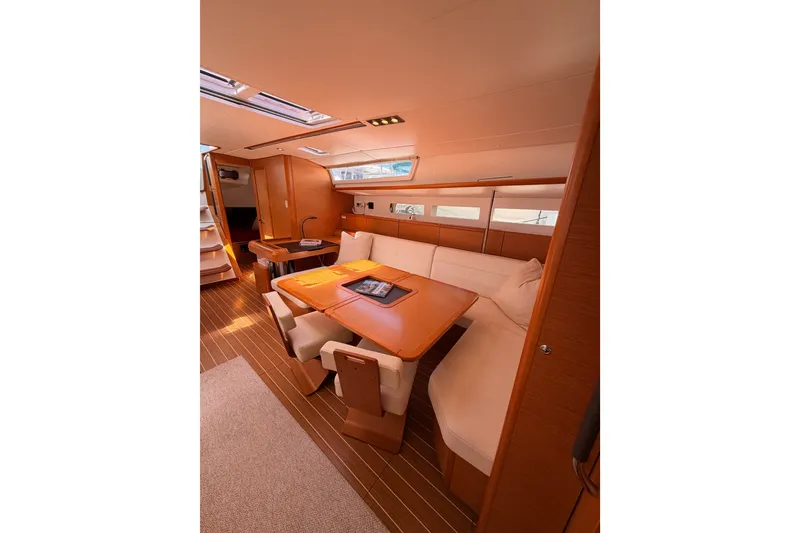 Slide: The Image of Luxurious interior of 2014 Jeanneau Sun Odyssey 509 yacht with elegant seating and wooden finishes. - 96