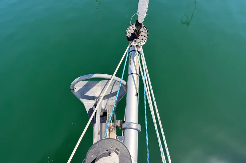 Slide: The Image of Bow view of 2014 Jeanneau Sun Odyssey 509 sailboat with anchor and calm green water. - 39