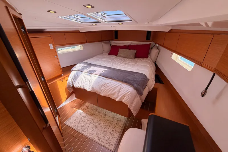Slide: The Image of Luxurious cabin interior of 2014 Jeanneau Sun Odyssey 509 yacht with cozy bedding. - 86
