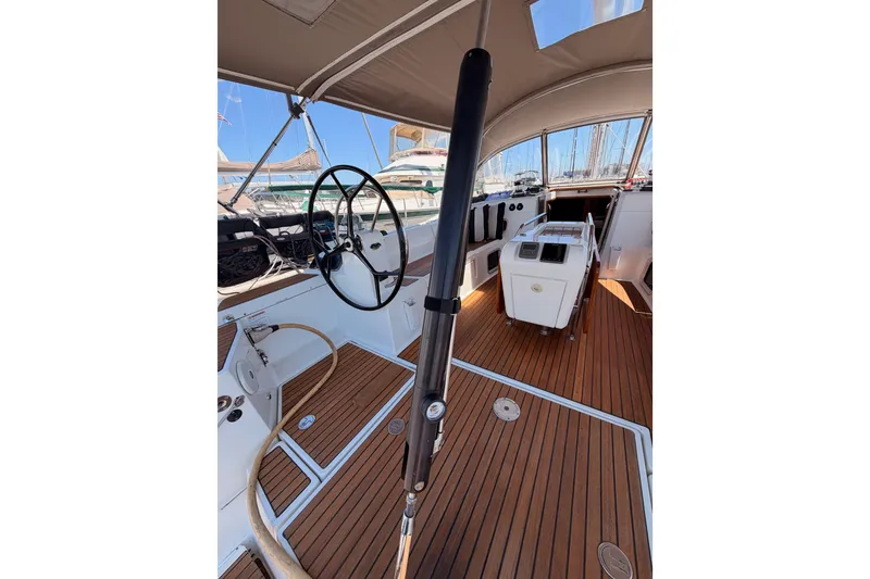 Slide: The Image of Cockpit of 2014 Jeanneau Sun Odyssey 509 sailboat with teak flooring and steering wheel. - 17