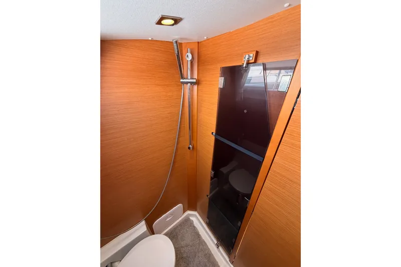 Slide: The Image of Bathroom interior of 2014 Jeanneau Sun Odyssey 509 yacht with modern shower and wooden finish. - 65