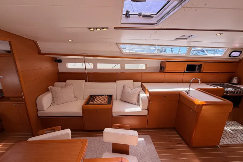 Slide: The Image of Luxurious interior of 2014 Jeanneau Sun Odyssey 509 yacht with modern kitchen and cozy seating area. - 78