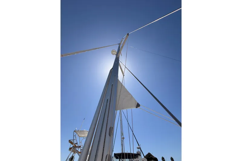 Slide: The Image of Sailboat mast of 2014 Jeanneau Sun Odyssey 509 against clear blue sky. - 42
