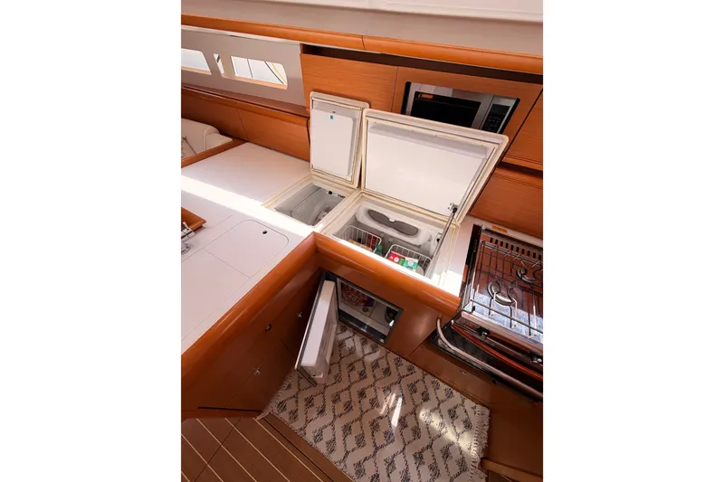 Slide: The Image of Interior of 2014 Jeanneau Sun Odyssey 509 yacht kitchen with open fridge and stove. - 55