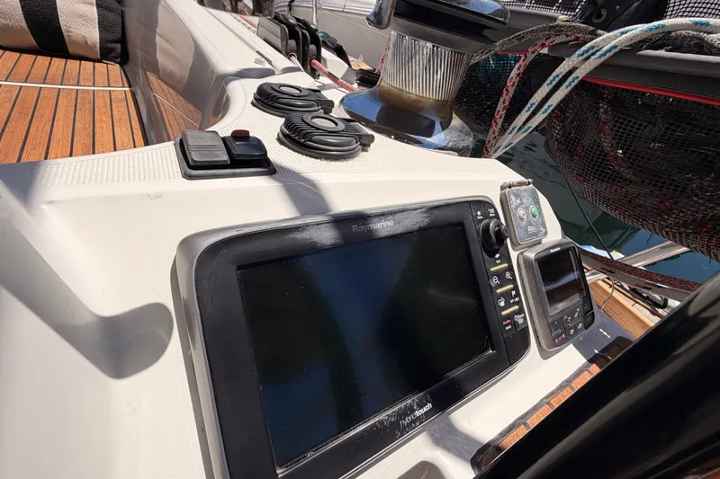 Slide: The Image of Cockpit of 2014 Jeanneau Sun Odyssey 509 with navigation equipment and winch. - 23