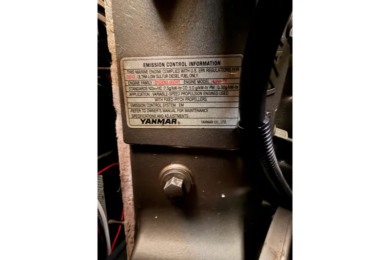 Slide: The Image of Engine emission control label on 2014 Jeanneau Sun Odyssey 509, featuring Yanmar specifications. - 100