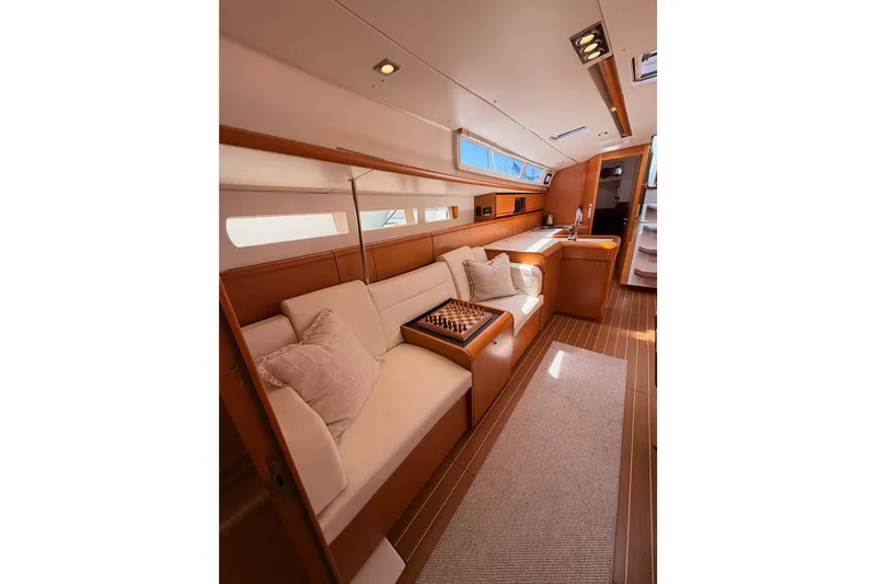 Slide: The Image of Luxurious interior of 2014 Jeanneau Sun Odyssey 509 yacht with elegant seating and chessboard. - 95