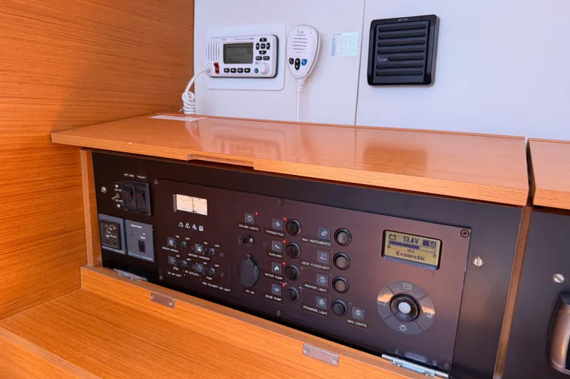 Slide: The Image of Control panel of a 2014 Jeanneau Sun Odyssey 509 yacht, featuring navigation and electrical systems. - 76