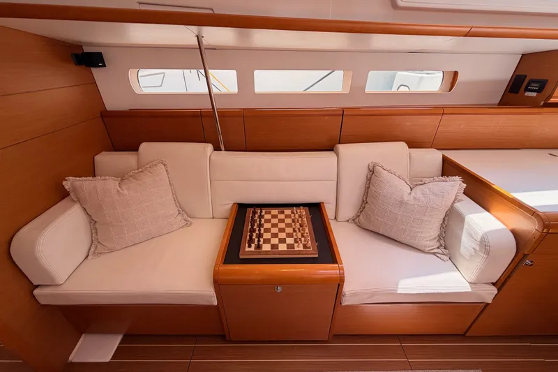 Slide: The Image of Luxurious interior of 2014 Jeanneau Sun Odyssey 509 yacht with chessboard on sofa. - 83
