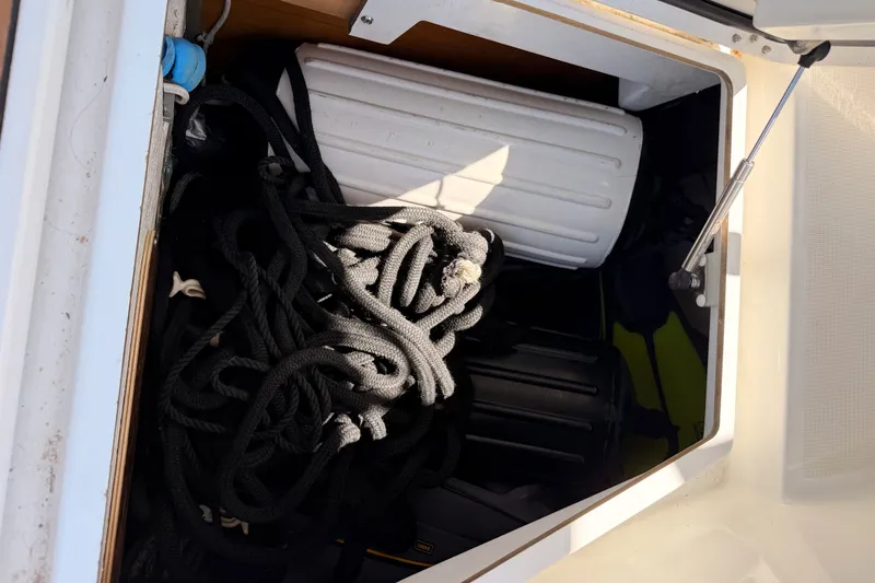 Slide: The Image of Storage compartment on a 2014 Jeanneau Sun Odyssey 509 with ropes and fenders. - 107