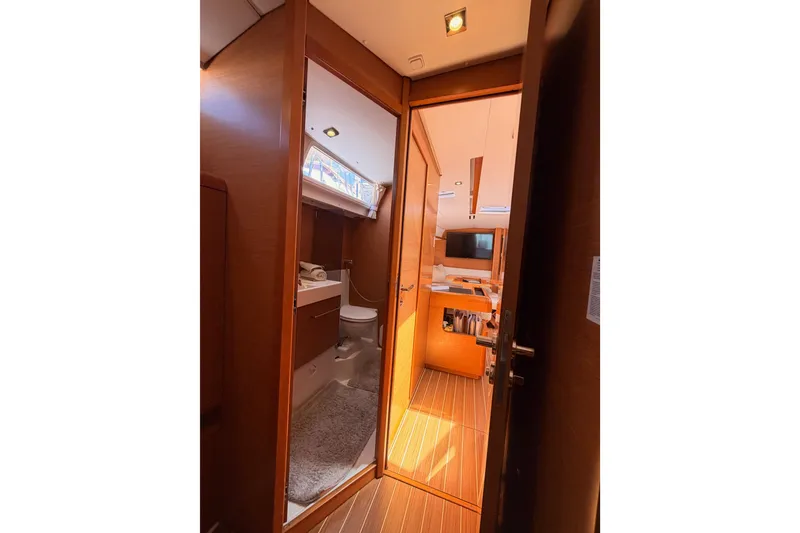 Slide: The Image of Interior view of 2014 Jeanneau Sun Odyssey 509 yacht, featuring bathroom and cabin. - 70