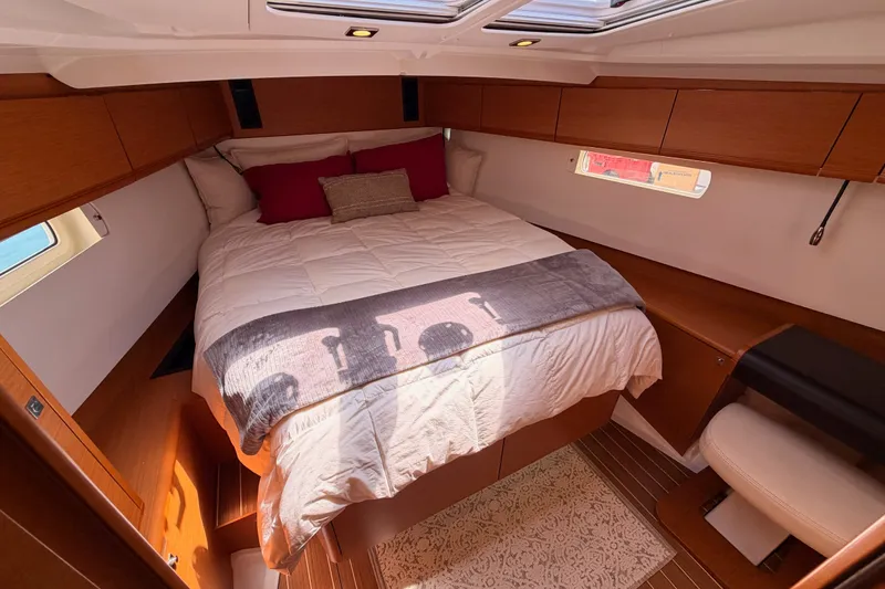 Slide: The Image of Luxurious cabin interior of 2014 Jeanneau Sun Odyssey 509 yacht with cozy bedding. - 92