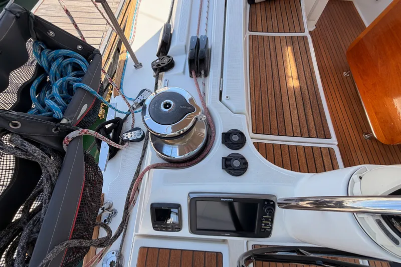 Slide: The Image of Deck of 2014 Jeanneau Sun Odyssey 509 sailboat with winch, ropes, and navigation equipment. - 29