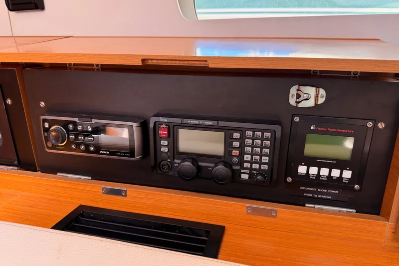 Slide: The Image of Control panel of a 2014 Jeanneau Sun Odyssey 509 yacht with navigation and communication equipment. - 77