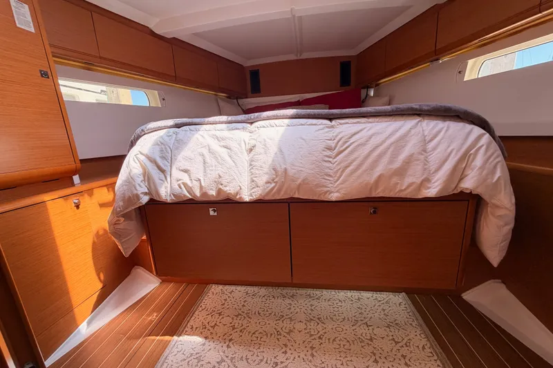 Slide: The Image of Luxurious cabin interior of 2014 Jeanneau Sun Odyssey 509 yacht with cozy bedding. - 87