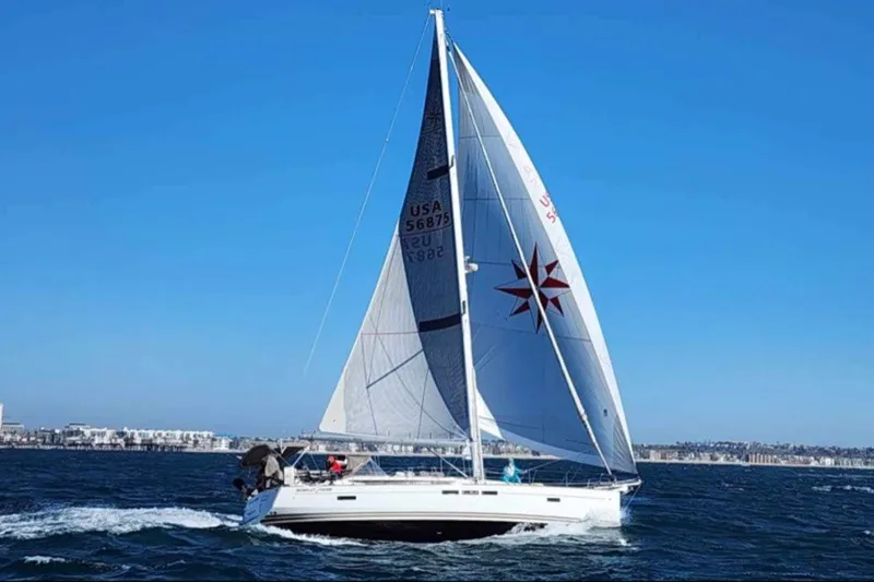 Slide: The Image of 2014 Jeanneau Sun Odyssey 509 sailing on open water under clear blue skies. - 3