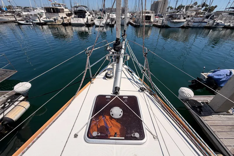 Slide: The Image of Jeanneau Sun Odyssey 509 sailboat docked in marina, 2014 model, viewed from bow. - 35