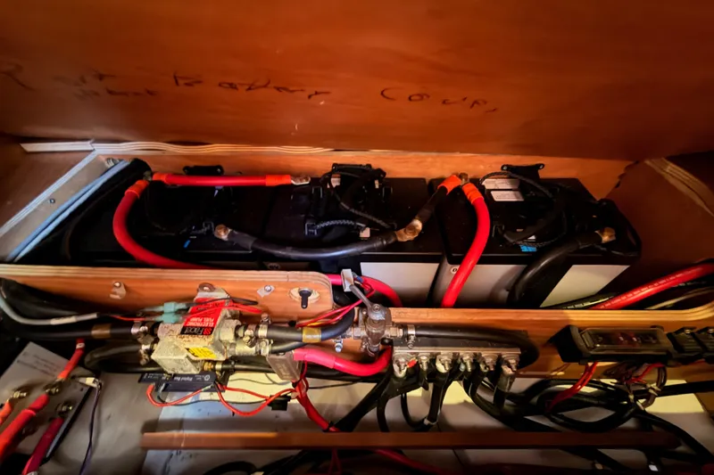 Slide: The Image of Electrical system of a 2014 Jeanneau Sun Odyssey 509 sailboat, featuring batteries and wiring. - 102