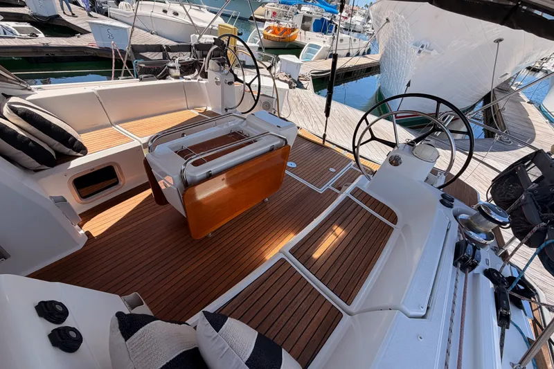 Slide: The Image of Cockpit of 2014 Jeanneau Sun Odyssey 509 yacht with dual steering wheels and teak flooring. - 46