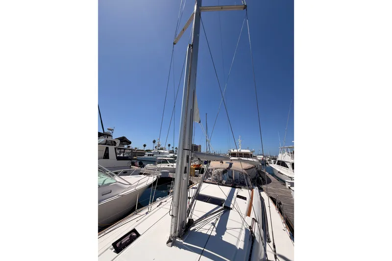 Slide: The Image of 2014 Jeanneau Sun Odyssey 509 sailboat docked at marina under clear blue sky. - 41