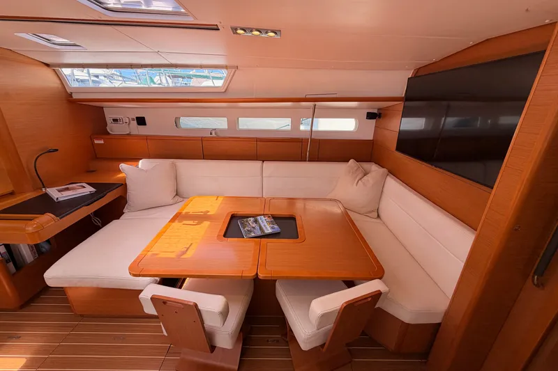 Slide: The Image of Luxurious interior of 2014 Jeanneau Sun Odyssey 509 yacht with elegant seating and wooden finishes. - 80