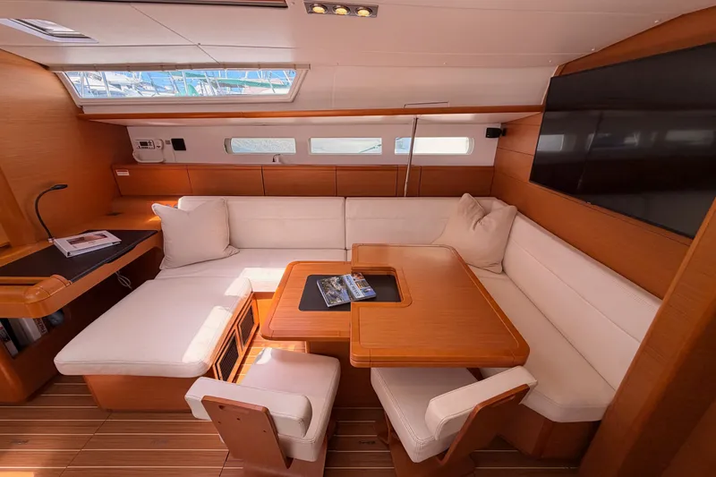 Slide: The Image of Luxurious interior of 2014 Jeanneau Sun Odyssey 509 yacht with elegant seating and wooden finishes. - 79