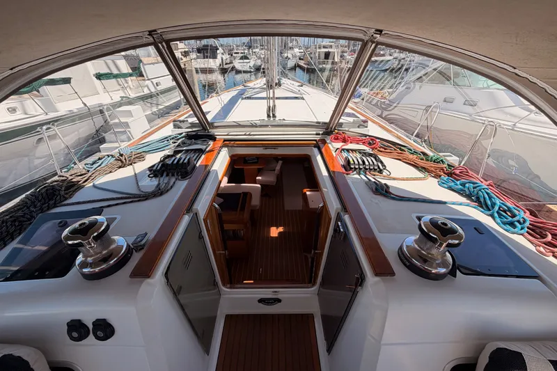 Slide: The Image of Cockpit view of 2014 Jeanneau Sun Odyssey 509 sailboat, showcasing deck and marina. - 50