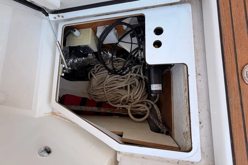 Slide: The Image of Storage compartment of a 2014 Jeanneau Sun Odyssey 509 sailboat with ropes and equipment. - 108