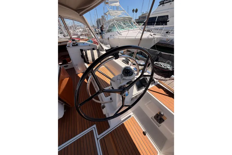 Slide: The Image of Cockpit of 2014 Jeanneau Sun Odyssey 509 sailboat with steering wheel and navigation instruments. - 22