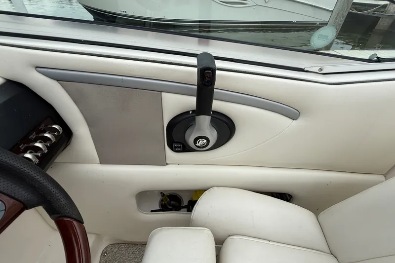 Slide: The Image of Interior view of a 2007 Sea Ray SLX 250 boat control panel and throttle. - 16