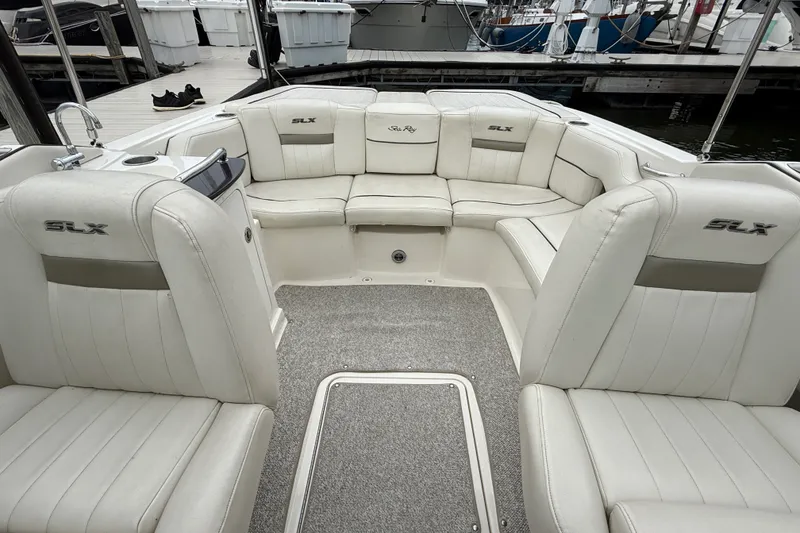 Slide: The Image of Interior of a 2007 Sea Ray SLX 250 boat with white leather seating. - 14