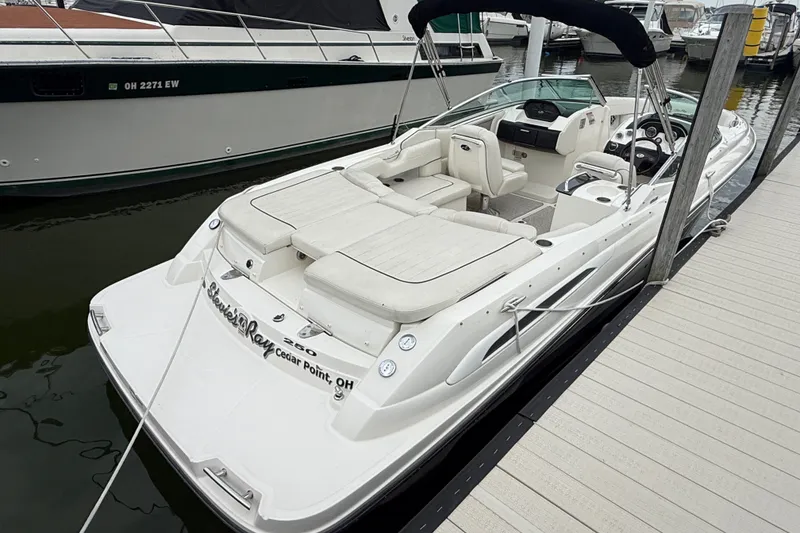 Slide: The Image of 2007 Sea Ray SLX 250 boat docked at marina, featuring spacious seating and sleek design. - 3